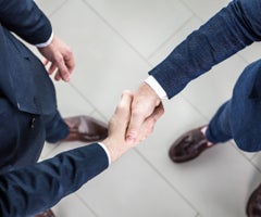 Business people shaking hands, finishing up a meeting
