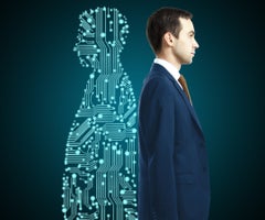 Businessman with digital partner standing back-to-back on dark background