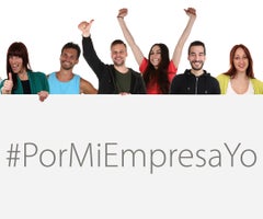 Large group of young multi ethnic people holding empty banner with copyspace