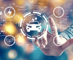 EV concept with man on blurred city light background