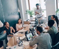 Group of young modern people in smart casual wear communicating