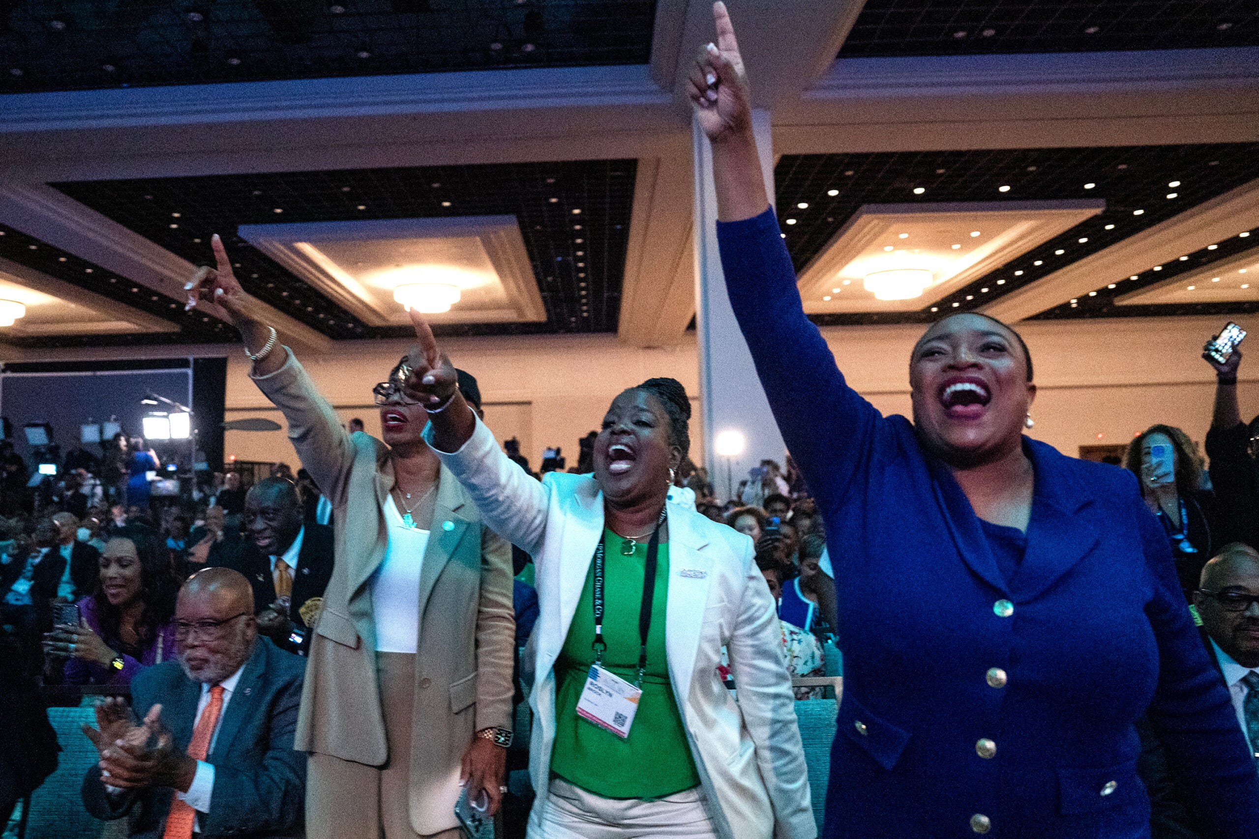 Attendees applaud Joe Biden during a convention in Las Vegas on July 16/Bloomberg