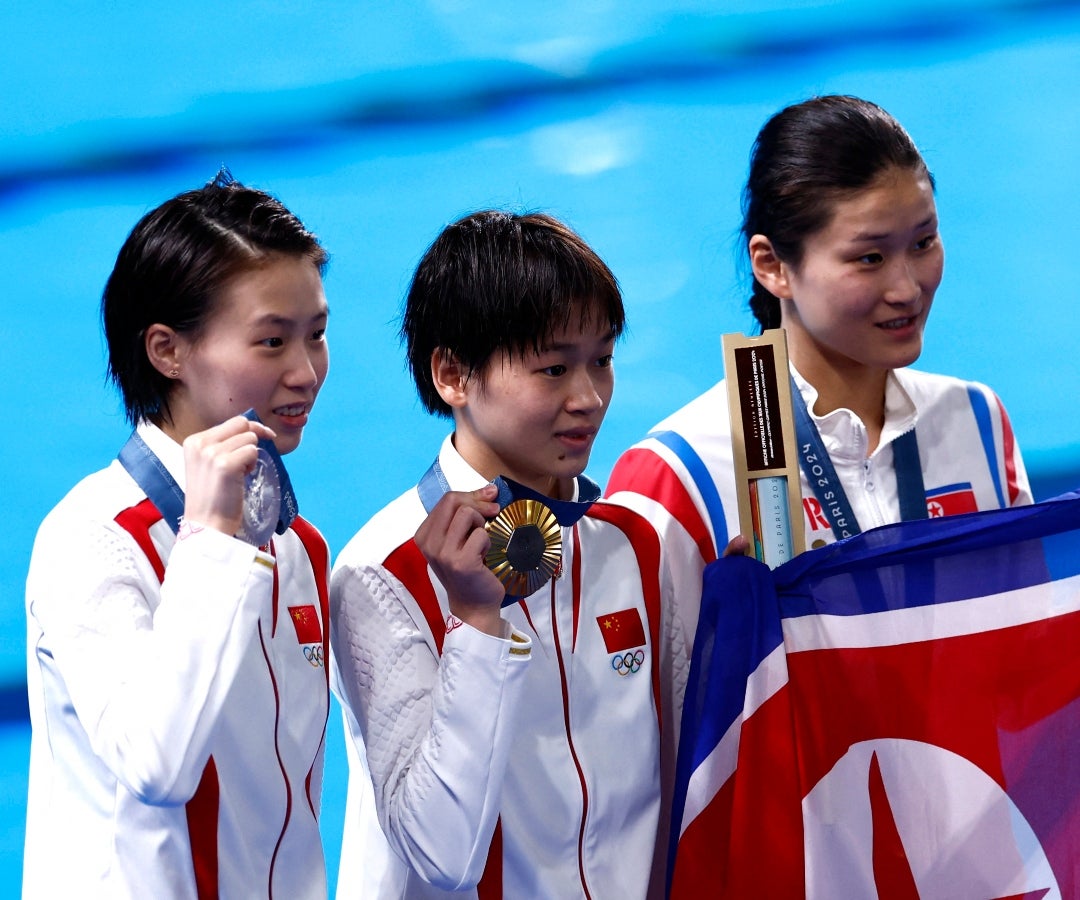 Quan Hongchan (oro), Chen Yuxi (plata) y Kim Mi Rae (bronce)