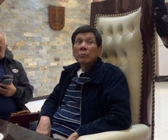 2025-03-11T094611Z_1902565199_RC2XADAAUPO9_RTRMADP_3_PHILIPPINES-ICC-DUTERTE (1)