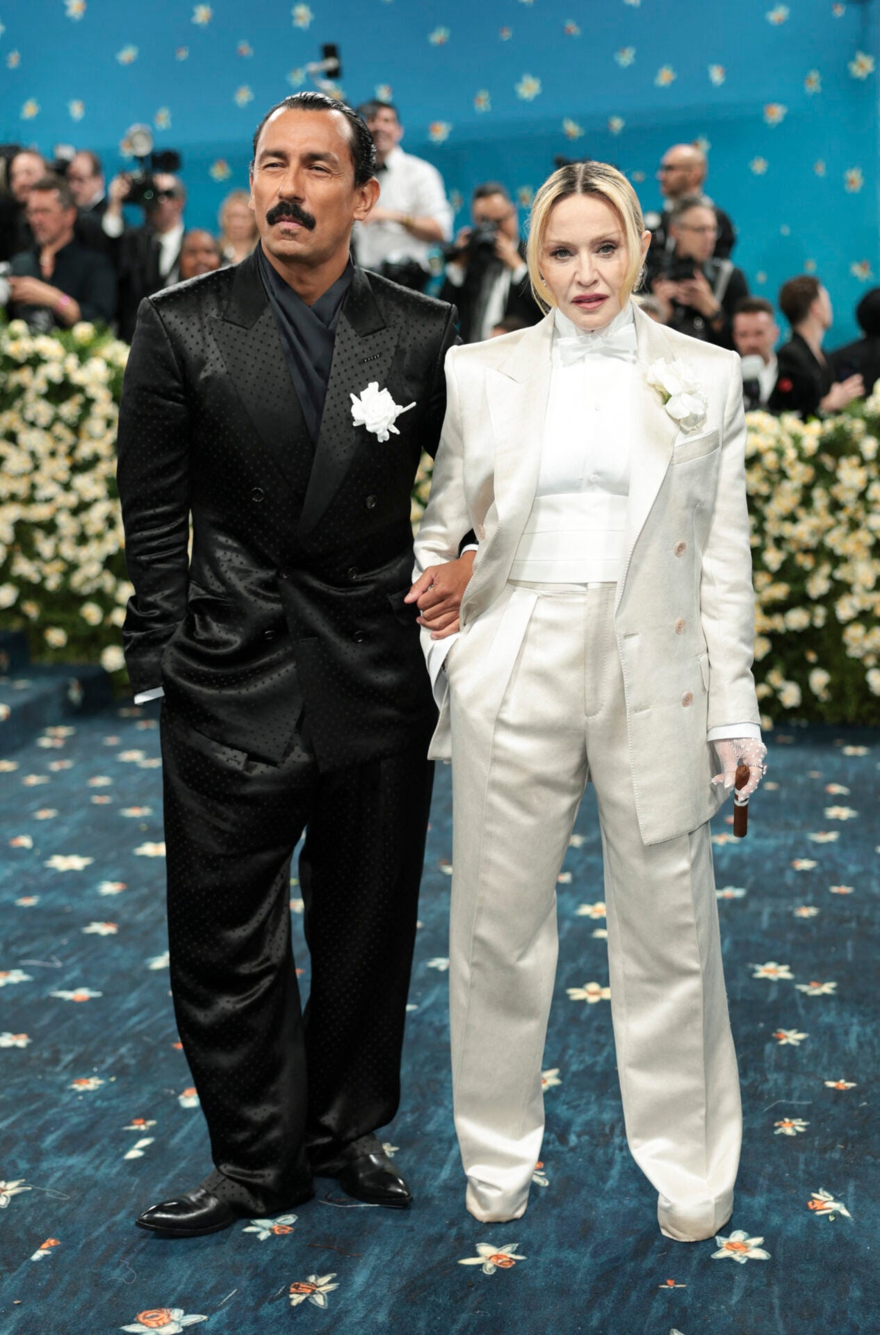 Haider Ackermann, diseñador de modas; y Madonna, cantante.